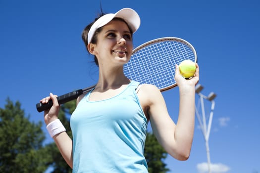 Young woman playing tennis, natural colorful tone