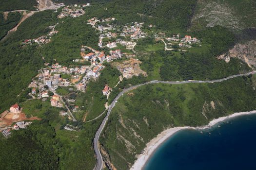 Kind at coast on Budva from an airplane from the height of bird flight. Montenegro