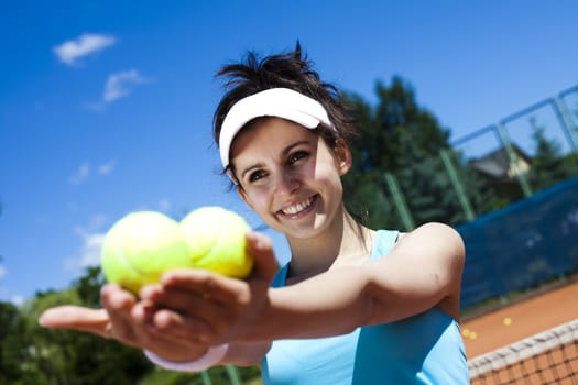 Young woman playing tennis, natural colorful tone