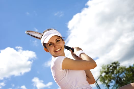 Young woman playing tennis, natural colorful tone