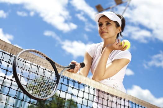 Young woman playing tennis, natural colorful tone