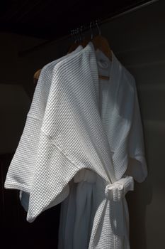 white bathrobe in wardrobe