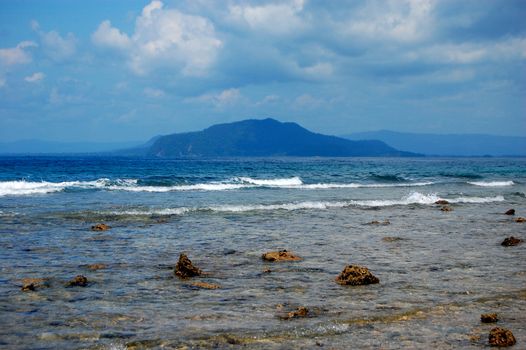 Stony coast at sea bay, Jayapura, Indonesia