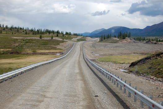 Gravel road at Kolyma state highway Russia outback