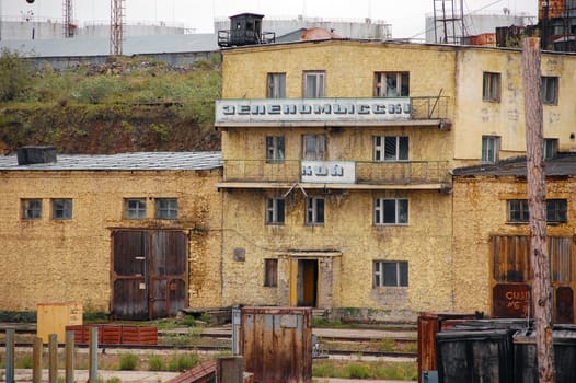 Abandoned office building at river port industrial area, Russia