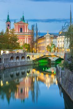 Romantic Ljubljana city center. River Ljubljanica, Triple Bridge - Tromostovje, Preseren square and Franciscan Church of the Annunciation. Ljubljana Slovenia Europe.