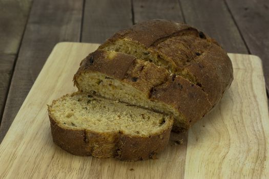 Loaf of wholemeal brown bread cut ready to serve