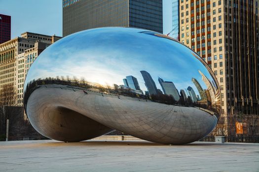 CHICAGO - APRIL 10: Cloud Gate sculpture in Millenium park on April 10, 2014 in Chicago, IL. This public sculpture is the centerpiece of the AT&T Plaza in Millennium Park within the Loop area.