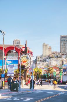 SAN FRANCISCO - APRIL 24: Famous Fisherman's Wharf sign with tourists on April 24, 2014 in San Francisco, California. It's one of the busiest and well known tourist attractions in the western United States.