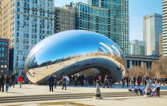 CHICAGO - APRIL 9: Cloud Gate sculpture in Millenium park on April 9, 2014 in Chicago, IL. This public sculpture is the centerpiece of the AT&T Plaza in Millennium Park within the Loop area.