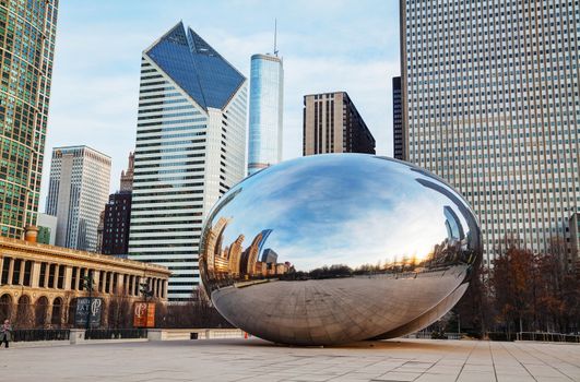 CHICAGO - APRIL 10: Cloud Gate sculpture in Millenium park on April 10, 2014 in Chicago, IL. This public sculpture is the centerpiece of the AT&T Plaza in Millennium Park within the Loop area.