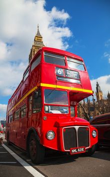 LONDON - APRIL 5: Iconic red double decker bus on April 5, 2015 in London, UK. The London Bus is one of London's principal icons, the archetypal red rear-entrance Routemaster recognised worldwide.