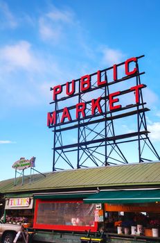SEATTLE - MAY 9: Famous Pike Place market sign on May 9, 2014 in Seattle, WA. The Market opened in 1907, and is one of the oldest continuously operated public farmers' markets in the US.