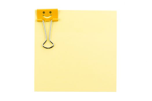 smile clip with note on white background from top view