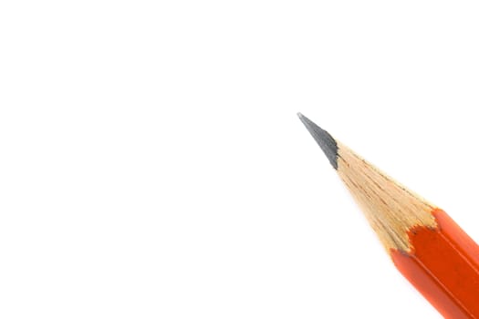 Red pencil on white background from top view Close up (isolated)