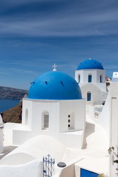 Blue and white church of Oia village on Santorini island. Greece