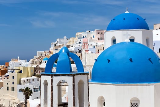 Blue and white church of Oia village on Santorini island. Greece