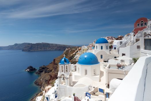 Blue and white church of Oia village on Santorini island. Greece