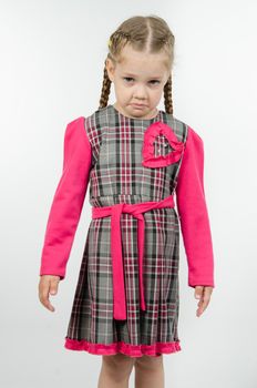 Half-length portrait upset and unhappy four-year girl Europeans