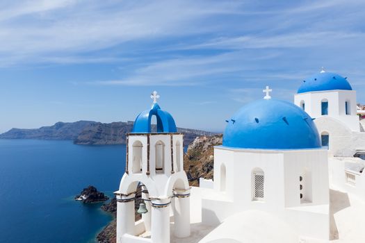 Blue and white church of Oia village on Santorini island. Greece