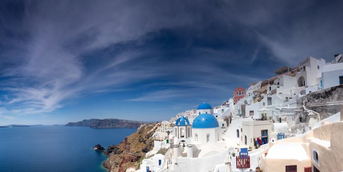 Blue and white church of Oia village on Santorini island. Greece