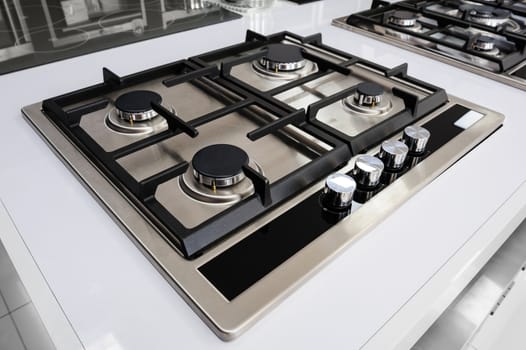 Brand new never used gas stove with stainless tray in appliance retail store