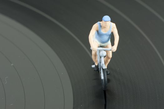 Model people having a cycle race on a record