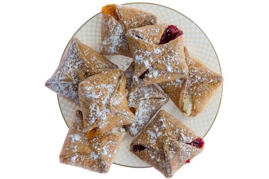 Plateful of crispy freshly baked crossover pastries filled with cheese and fruity preserve of peach and strawberry, overhead view isolated on white