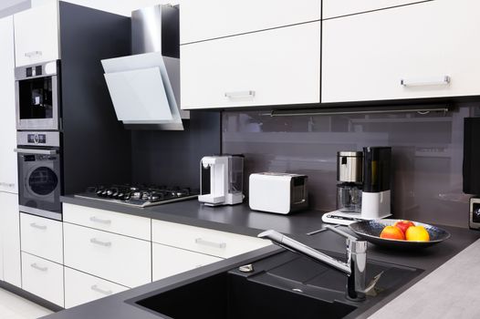 Modern luxury hi-tek black and white kitchen, clean interior design