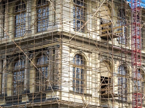 Fragment of scaffolding against house wall in Prague