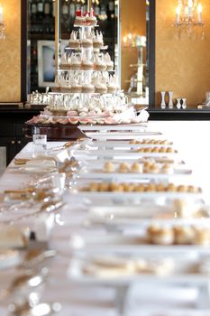 Table with cupcakes bread and dessert in party