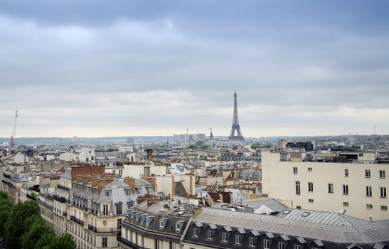 Roofs of Paris with Eiffel Tower in background, France.