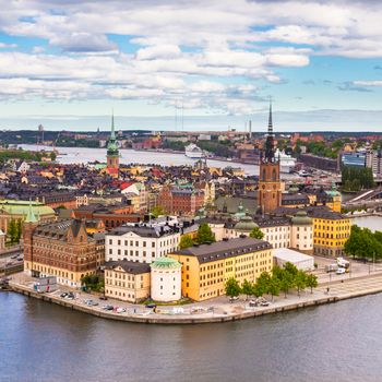 Panoramic view of swedish capital Stockholm seen from the city hall tower. Aerial view of Gamla stan, old medieval downtown. Square composition.