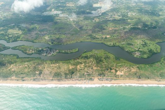 Aerial view of the Atlantic Ocean coastline along the shores of Cotonou, Benin