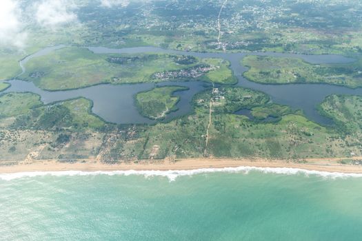 Aerial view of the Atlantic Ocean coastline along the shores of Cotonou, Benin