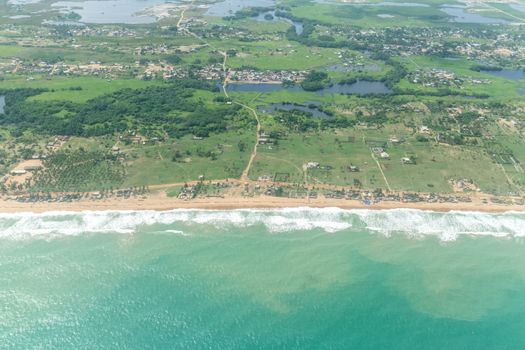 Aerial view of the Atlantic Ocean coastline along the shores of Cotonou, Benin