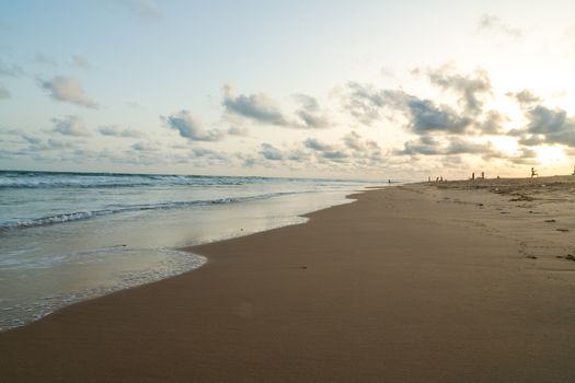 Waves of the Atlantic Ocean landing on the shores of Obama Beach in Cotonou, Benin