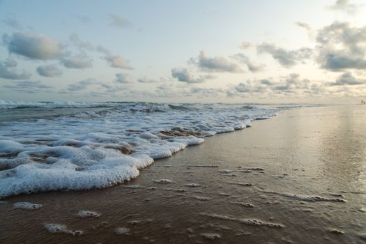 Waves of the Atlantic Ocean landing on the shores of Obama Beach in Cotonou, Benin