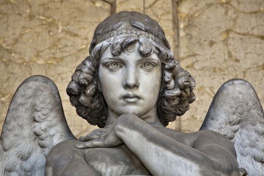 portrait of angel on marble, monumental cemetery of Genoa, more than 100 years old statue