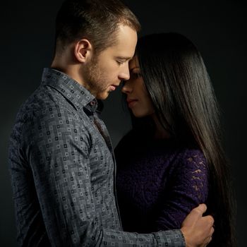 sensual couple in love on dark background