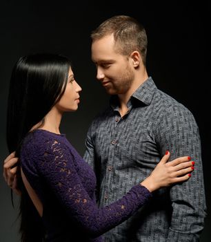 sensual couple in love on dark background