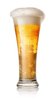 Light beer in a glass isolated on white