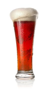 Red beer in a glass isolated on white