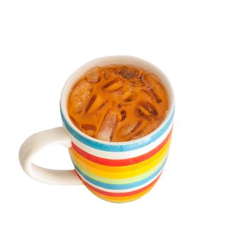 Thai iced milk tea in rainbow cup, isolated on white 