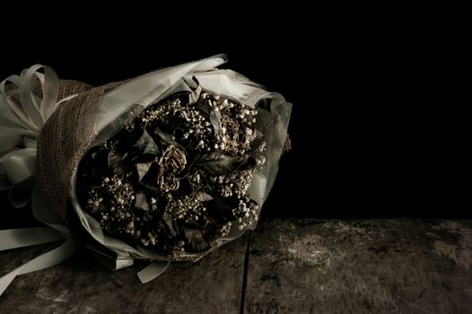 Still life with flower on black background and old wooden table, Dark and shadow