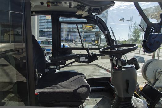 A view inside a truck with a steering wheel