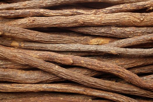 Liquorice root pieces as an abstract background texture