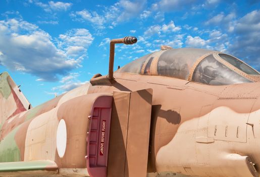 Fighter aircraft cabin detail with blue sky background