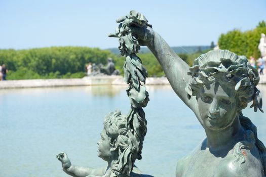 Statue of woman by fountain in detail