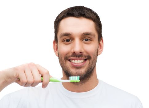 health and beauty concept - smiling young man with toothbrush
